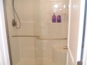 New walk-in shower with glass doors