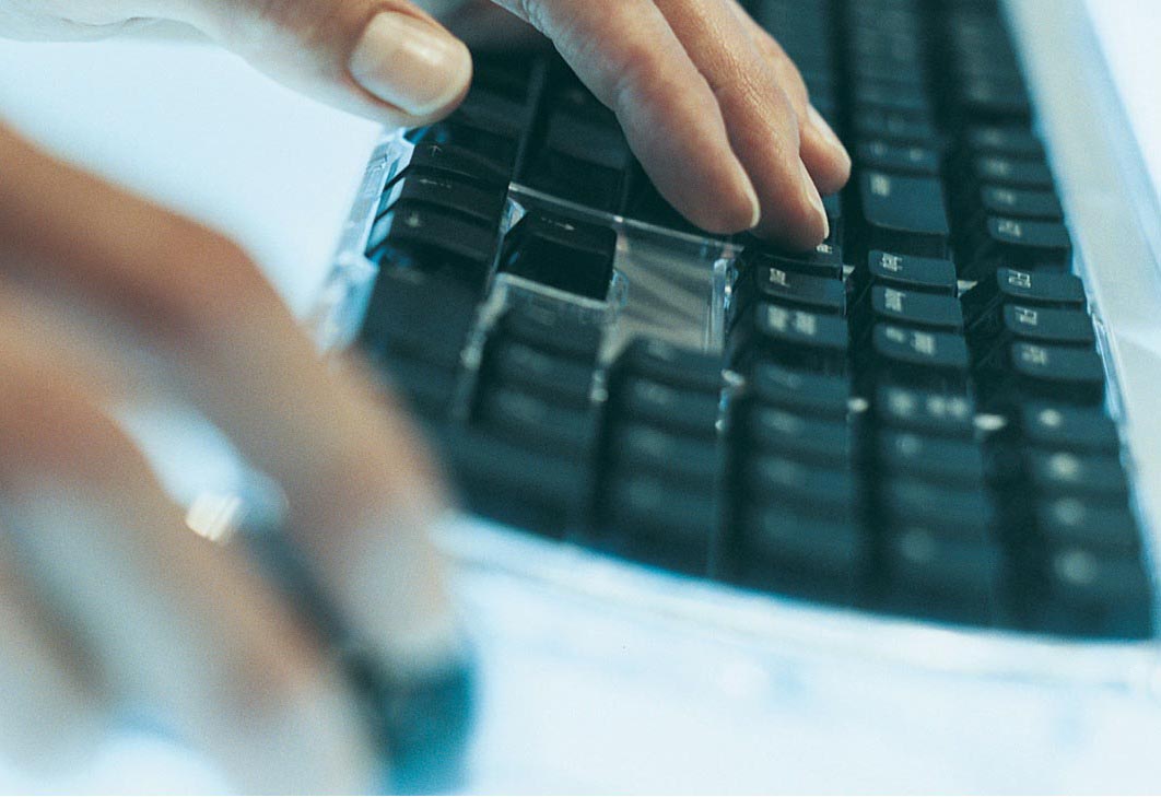 a keyboard and a hand