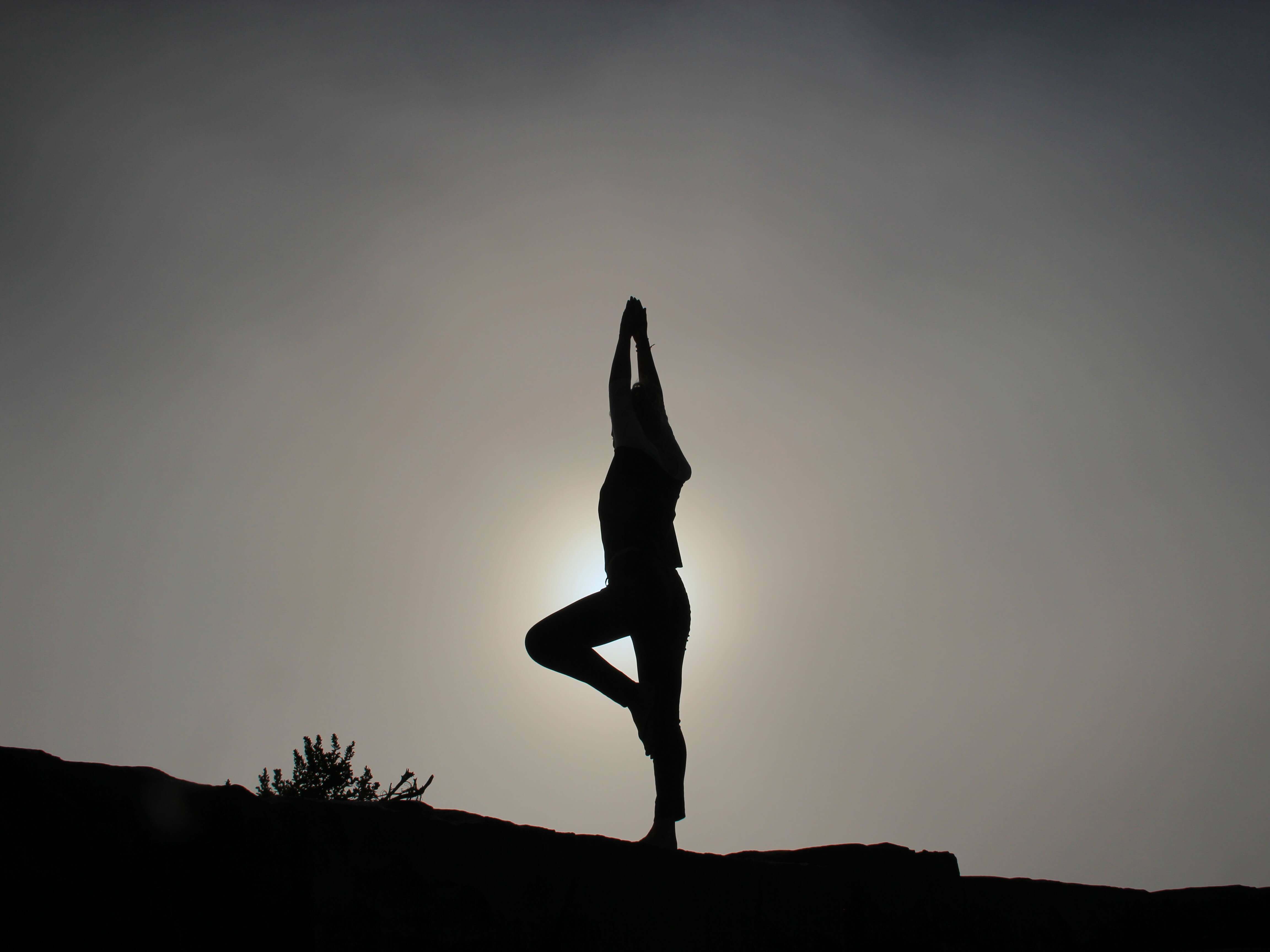 woman performing yoga pose